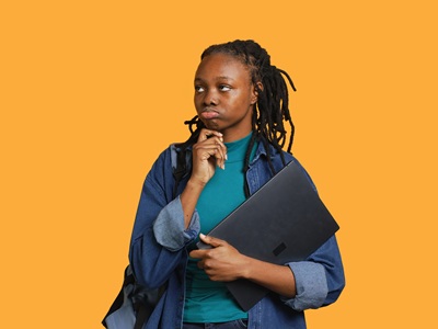 Pensive woman carrying laptop, doing thinking gesture, studio background